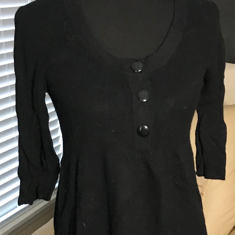 Women’s black knit dress.